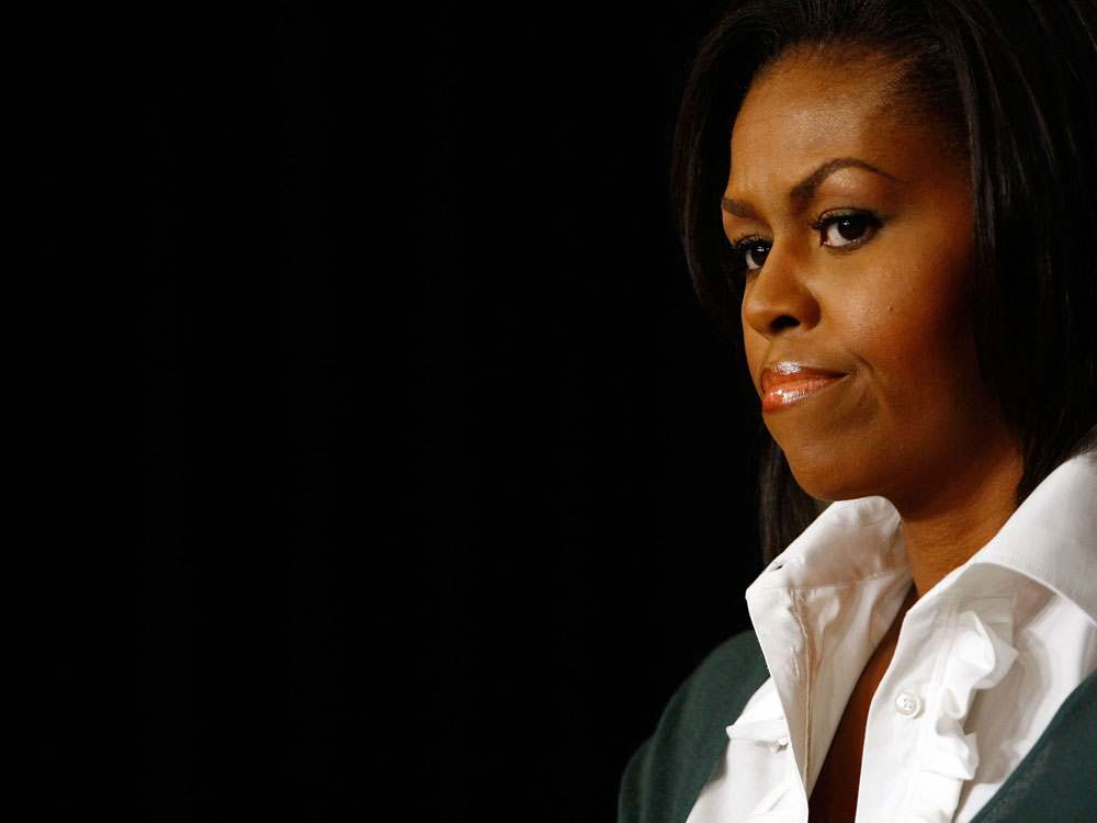 First lady Michelle Obama listens to remarks on health care legislation at the White House complex September 18, 2009 in Washington, DC. (Photo by Win McNamee/Getty Images) 