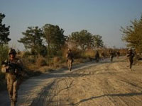 U.S. Marines on patrol in Helmand Province, Afghanistan; October 2009. (Graham Smith/NPR)