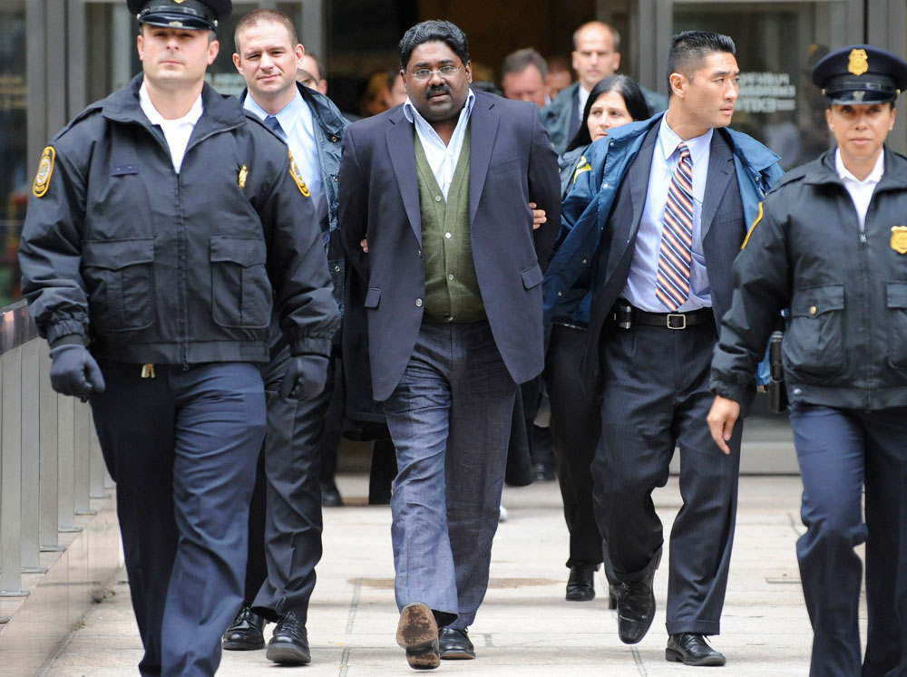 Raja Rajaratnam in handcuffs.