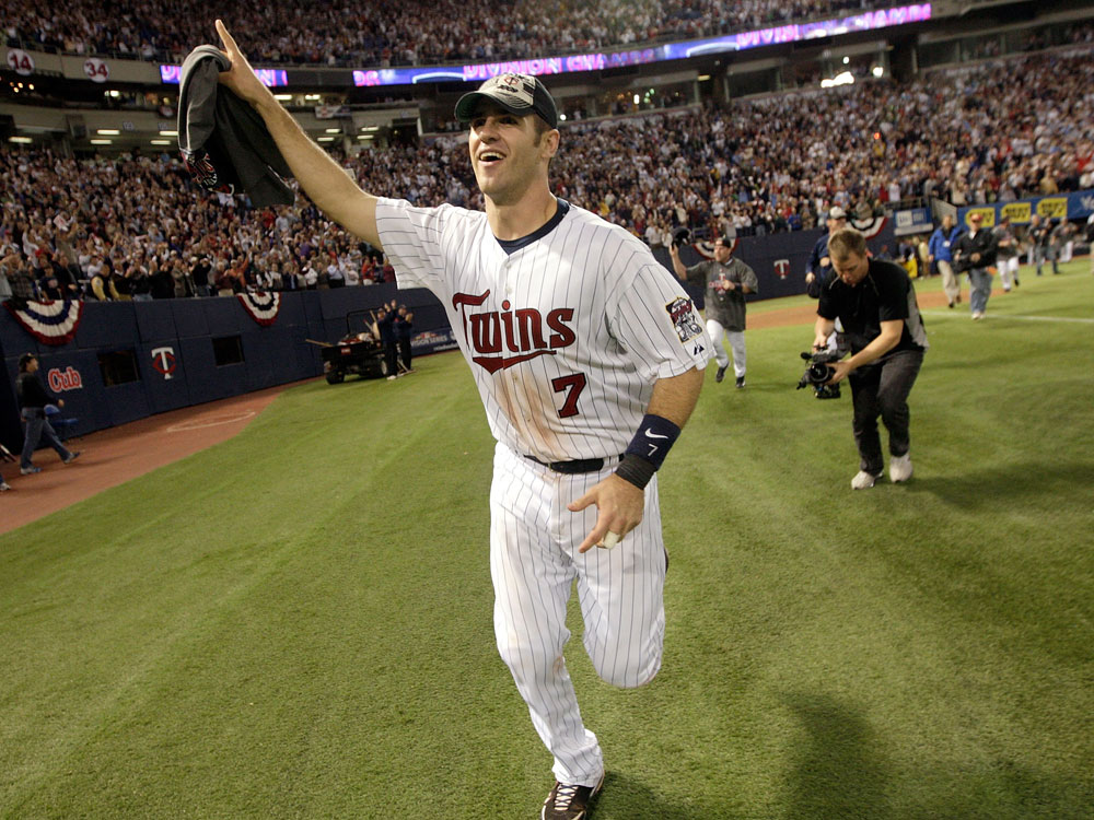  Joe Mauer of the Minnesota Twins circles the field after his team defeated the Detroit Tigers to win the American League Tiebreaker game on October 6, 2009 at Hubert H. Humphrey Metrodome in Minneapolis, Minnesota. (Photo by Jamie Squire/Getty Images)