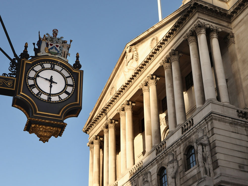 A clock on the Royal Exchange shows a time of 9:30 a.m. in front of the Bank of England at the moment when the Office for National Statistics announced that the U.K. is in the longest recession since records began.  (Photo by Oli Scarff/Getty Images) 