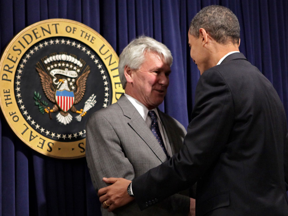 President Barack Obama, right, greets Greg Craig, left, his choice for White House counsel, as he meets with senior staff to assert expectations on ethics and conduct, at the Eisenhower Executive Office Building in the White House complex in Washington, Wednesday, Jan. 21, 2009. (AP Photo/J. Scott Applewhite)