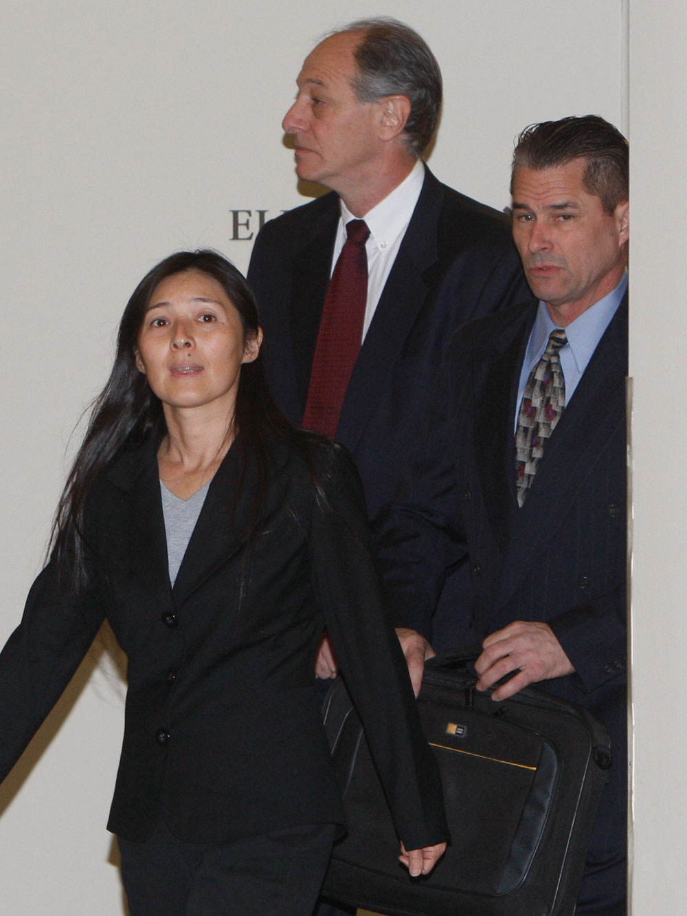 Mayumi, left, and Richard Heene arrive at district court in Fort Collins, Colo., on Friday, Nov. 13, 2009, with attorney Dave Lane, center. (AP Photo/Ed Andrieski)