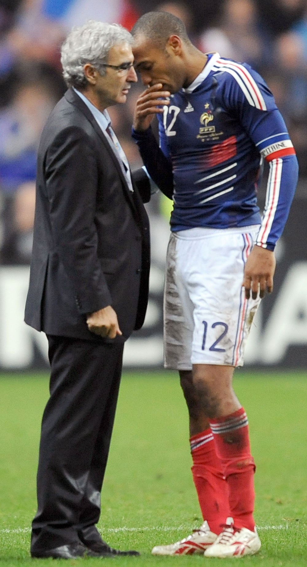 French coach Raymond Domenech (L) speaks with French forward Thierry Henry at the end during the World Cup 2010 qualifying football match France vs. Republic of Ireland on November 18, 2009 at the Stade de France in Saint-Denis, northern Paris.(Lionel Bonventure/AFP/Getty Images) 