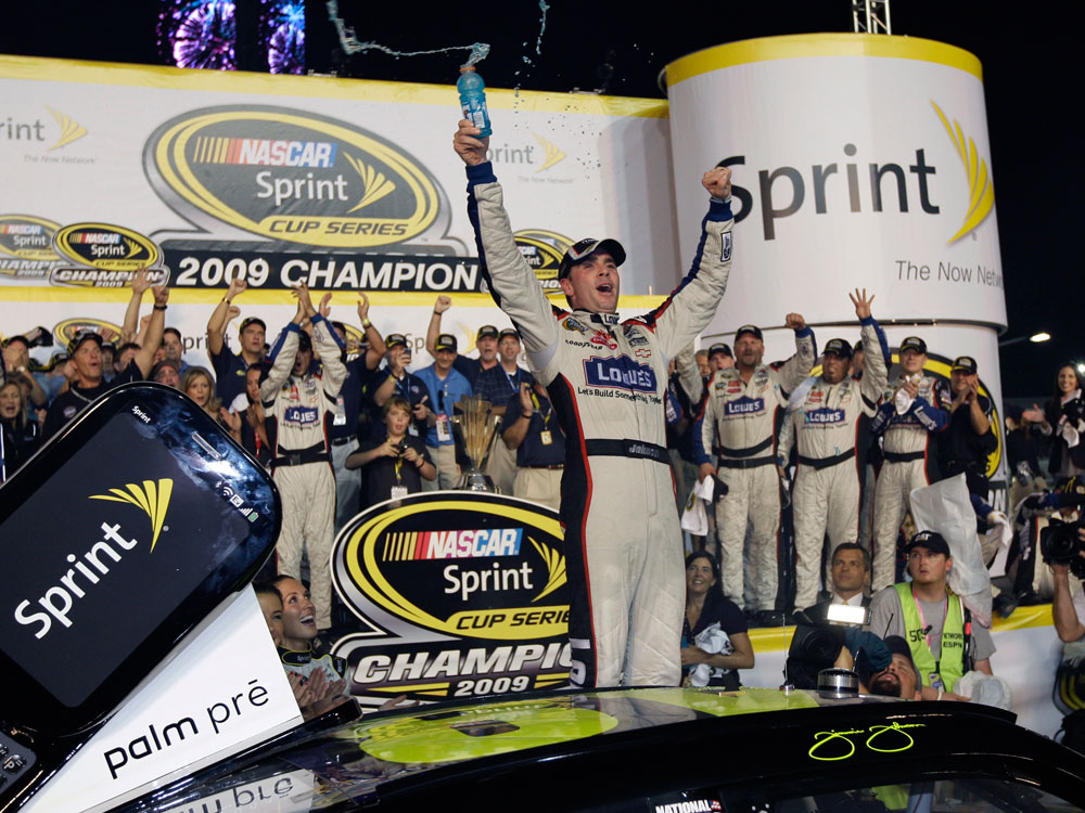Jimmie Johnson celebrates after winning the NASCAR Sprint Cup Series season championship, at Homestead-Miami Speedway in Homestead, Fla., Sunday, Nov. 22, 2009. (AP Photo/Chuck Burton)