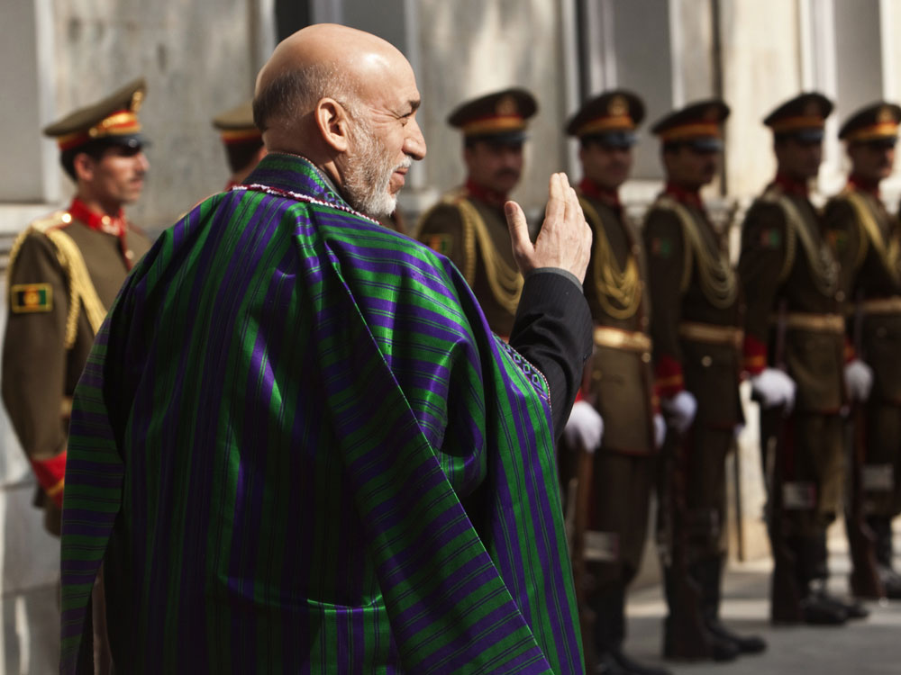 Afghan President Hamid Karzai and an honor guard await United Nations Secretary General Ban Ki-moon at the Presidential Palace in Kabul on November 2, 2009. (Ahmad Masood/AFP/Getty Images) 