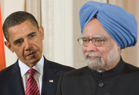 President Barack Obama stands alongside Indian Prime Minister Manmohan Singh during a State Arrival in the East Room of the White House in Washington, DC, on November 24, 2009. (Saul Loeb/AFP/Getty Images)