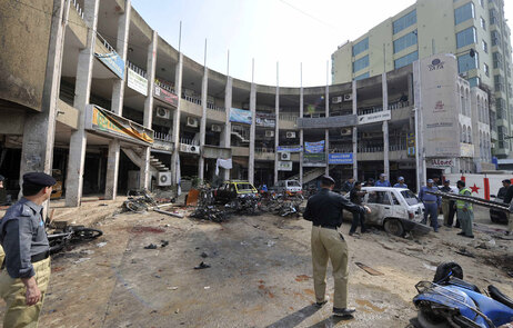 Pakistani policemen secure the site after a suicide bomb blast in Rawalpindi on November 2, 2009. (Aamir Qureshi/AFP/Getty Images)