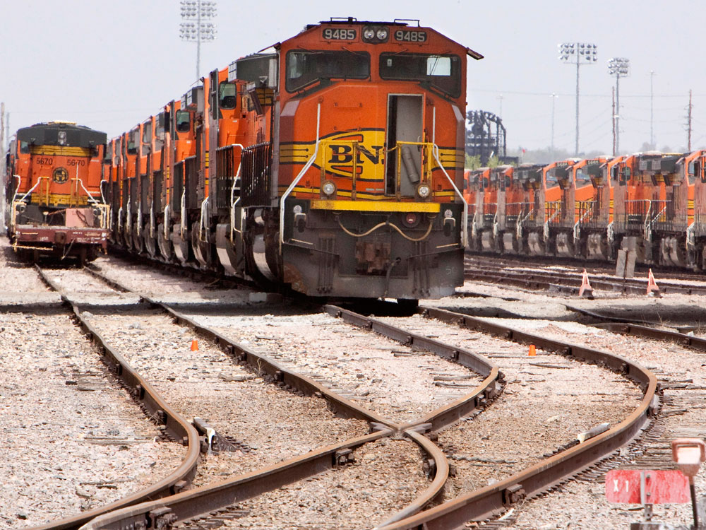 Idle Burlington Northern Santa Fe locomotives sit in a railyard in Lincoln, Neb., Tuesday, May 5, 2009. (AP Photo/Nati Harnik)