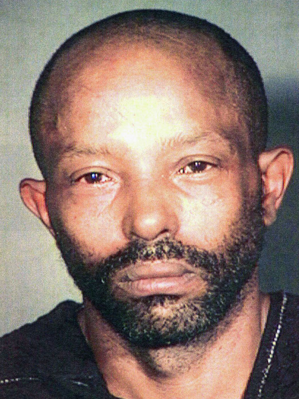 This Nov. 1, 2009 photo provided by the Cleveland Police Department shows Anthony Sowell, 50, who Cleveland Police arrested Saturday, Oct. 31 on a rape and felonious assault warrant. The number of bodies found in and near Sowell's home rose to at least 10 on Tuesday, Nov. 3 when authorities unearthed four corpses from the backyard and found a skull in a bucket in the basement. (AP Photo/Cleveland Police Department)