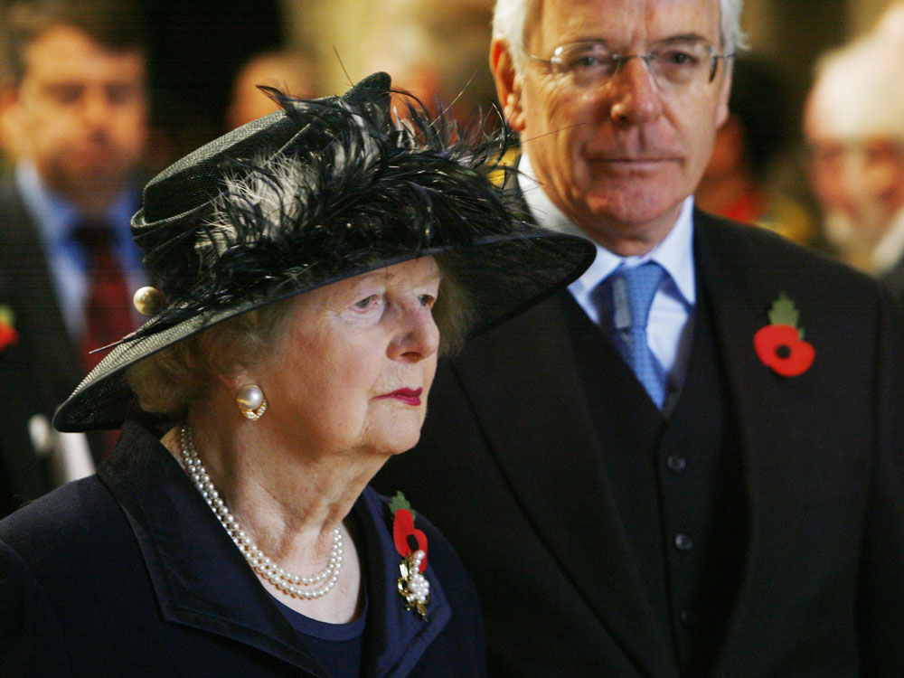 Armistice Day events. Former prime ministers, Baroness Margaret Thatcher (left) and John Major, (right), attend a memorial service to mark the passing of the World War I generation at Westminster Abbey in central London. Picture date: Wednesday November 11, 2009. (Press Association via AP Images)