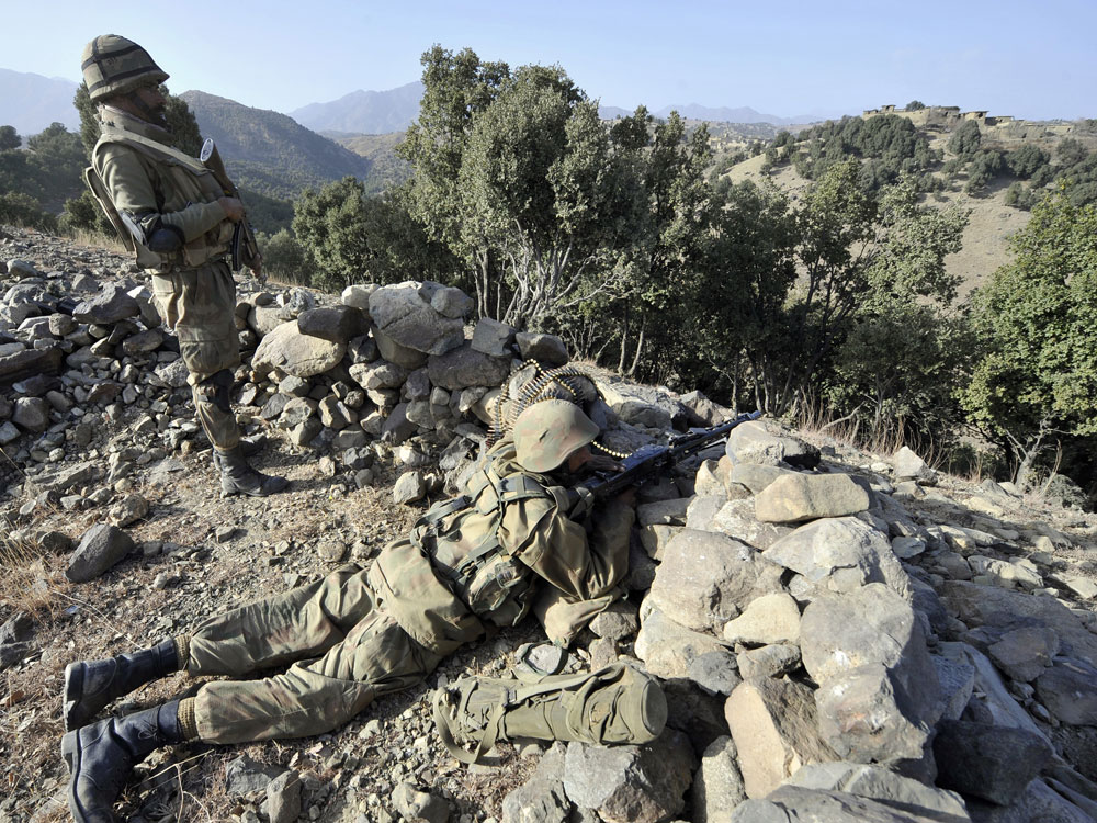 Pakistani soldiers stand on a secured location on a hill in Ladha town, which was the stronghold of Taliban militants in troubled South Waziristan, on November 17, 20009. Pakistan dispatched 30,000 troops into battle on October 17. (Aamir Qureshi/AFP/Getty Images) 