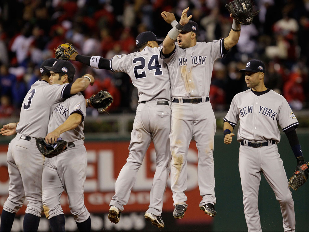 New York Yankees celebrate after winning Game 4 of the Major League Baseball World Series against the Philadelphia Phillies Sunday, Nov. 1, 2009, in Philadelphia. The Yankees defeated the Phillies 7-4 to take a 3-1 lead in the series. (AP Photo/David J. Phillip)