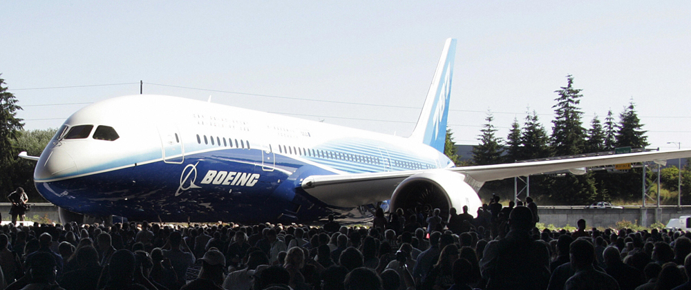 In this 08 July 2007 file photo, the new Boeing 787 Dreamliner is unveiled during the world premiere of this aircraft in Everett, Washington. (Tangi Quemener/AFP/Getty Images) 