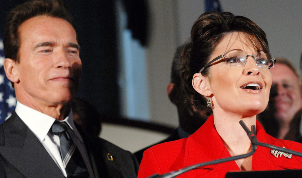 Alaska Governor Sarah Palin (R) answers questions from the media as California Governor Arnold Schwarzenegger listens at the meeting of the National Governor's Association after the governors spoke with President-Elect Barack Obama and Vice-President -Elect Joe Biden at Independence Hall December 2, 2008 in Philadelphia. (Photo by William Thomas Cain/Getty Images) 
