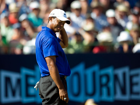 Tiger Woods from the United States reacts after missing a putt on the 16th green during the second round of the Australian Masters golf tournament at the Kingston Heath Golf Club in Melbourne, Australia, Friday, Nov. 13, 2009. (AP Photo/Andrew Brownbill)