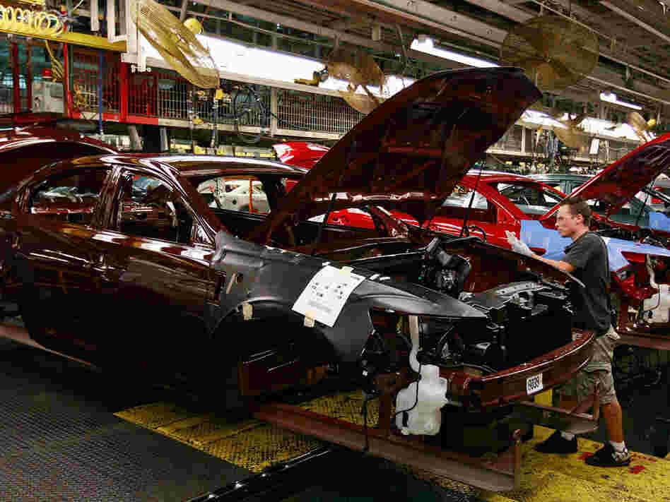 A worker builds cars on the assembly line at Ford's Chicago Assembly plant August 4, 2009 in Chicago
