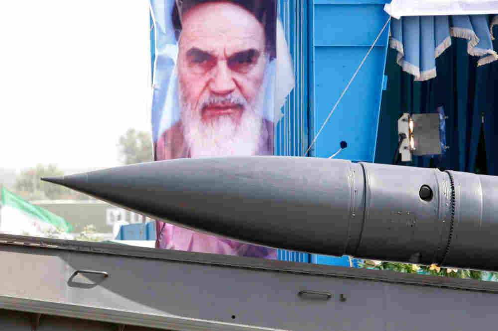 Iran rejected Secretary of State Hillary Clinton's charge that Iran is becoming a military dictators Iran rejected Secretary of State Hillary Clinton's charge that Iran is becoming a military dictators