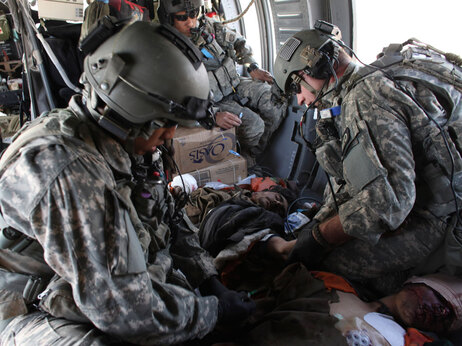 Injured Taliban fighters receive medical treatment after they were captured. Aboard a Blackhawk helicopter on a medevac mission, with U.S. Army flight medic Sgt. Michael G. Patangan, left, from Houston, Texas, and fellow flight medic Sgt. Bryan Eickelberg, of Arden Hills, Minn. Saturday Feb. 13, 2010. (AP Photo/Brennan Linsley)