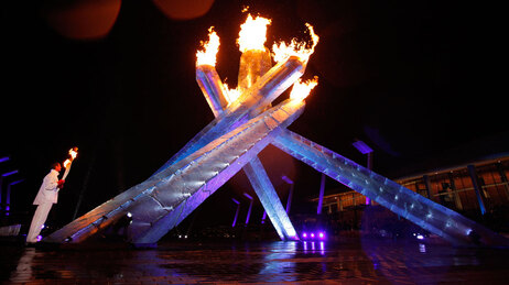 Canadian ice hockey legend Wayne Gretzky lights the Olympic flame during the Opening Ceremony of the Vancouver 2010 Olympics in Vancouver, British Columbia, Friday, Feb. 12, 2010. (AP Photo/Jae C. Hong)