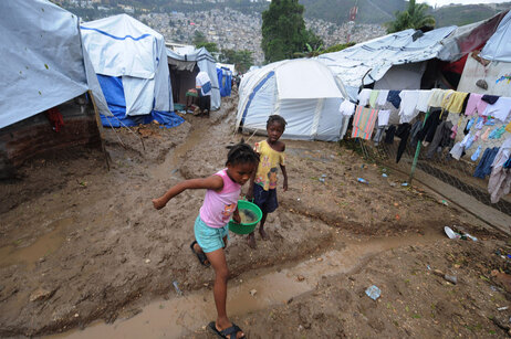 Haiti's refugee camps are increasingly muddy as the rainy season adds to the misery of earthquake survivors.