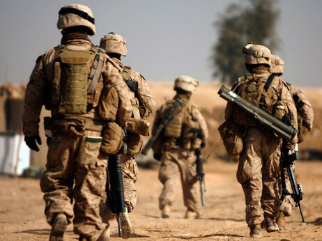 US Marines with 1/3 Charlie company leave their combat outpost in Trikh Nawar on the northeastern outskirts of Marjah on February 23, 2010. (Photo by Patrick Baz/AFP/Getty Images)