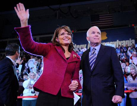 Republican presidential candidate John McCain and his vice presidential candidate Sarah Palin wave at a campaign rally at Giant Center in Hershey, Pennsylvania, on October 28, 2008. (Robyn Beck/AFP/Getty Images)