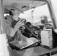 circa 1956: A New York State Trooper calls in, having just detected a speeding motorist. (Photo by Three Lions/Getty Images) class=
