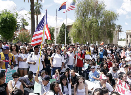 Arizona Gov. Jan Brewer signed controversial, get-tough legislation on illegal immigration.