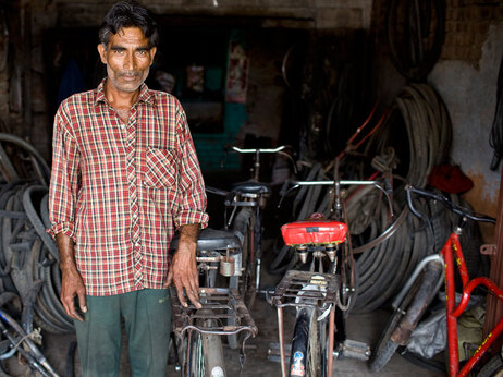A bike shop owner in Aligarh. (Kainaz Amaria for NPR)