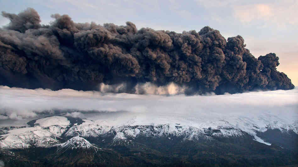 Smoke and steam hangs over the volcano under the Eyjafjallajokull glacier in Iceland, Wednesday Apri
