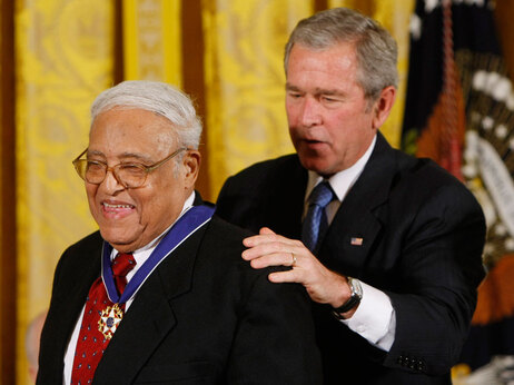 President Bush, right, presents the Presidential Medal of Freedom to Civil Rights pioneer Benjamin Hooks during a ceremony in the East Room of the White House in Washington, Monday, Nov. 5, 2007. (AP Photo/Gerald Herbert)