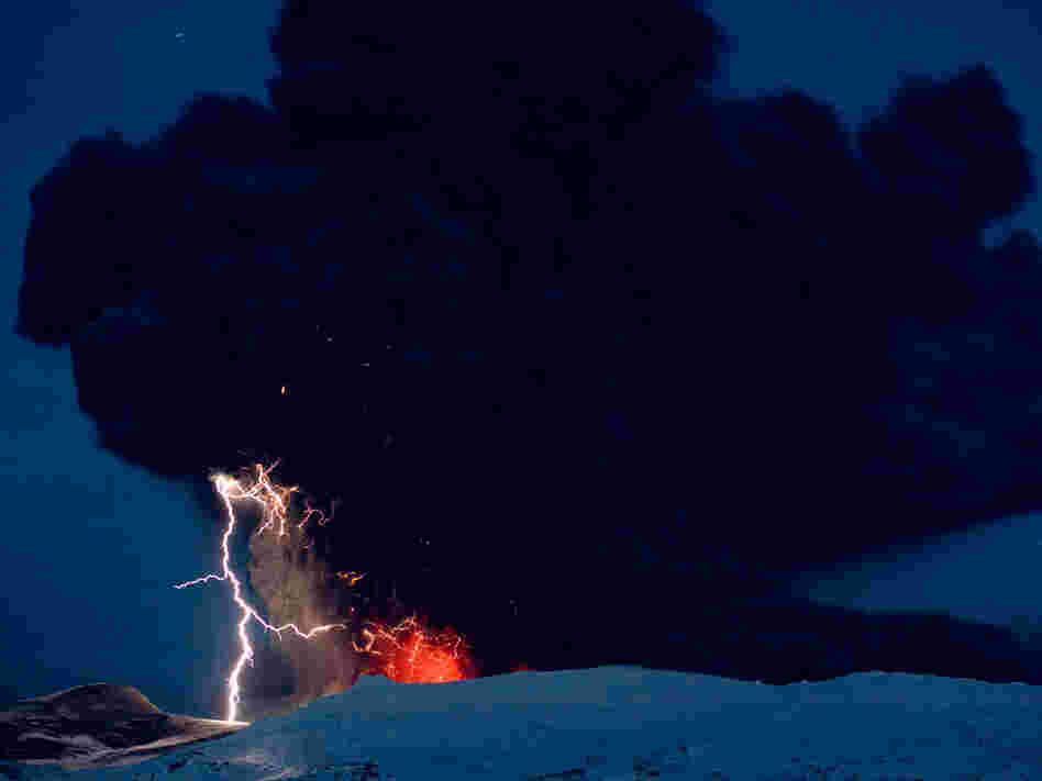Lighting seen amid the lava and ash erupting from the vent of the Eyjafjallajokull volcano in centra