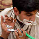Barber Mahendra Singh shaves NPR's Nishant Dahiya on the banks of the Ganges River in Varanasi, Indi Barber Mahendra Singh shaves NPR's Nishant Dahiya on the banks of the Ganges River in Varanasi, Indi