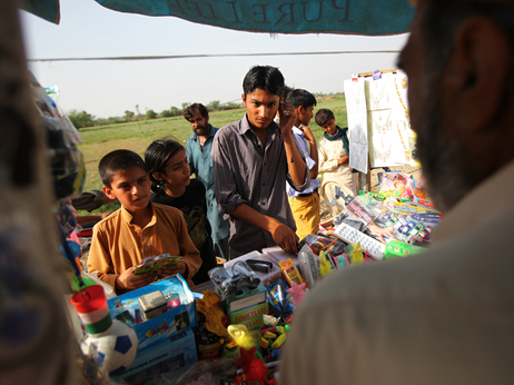 Mohammad Shoib, 16, sells little gifts at a stand near the border with India. (Photo by John Poole/NPR)