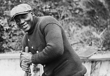 Boxer Jack Johnson, former Heavyweight Champion of the World, enjoys a moment in San Francisco in the early 1910s.