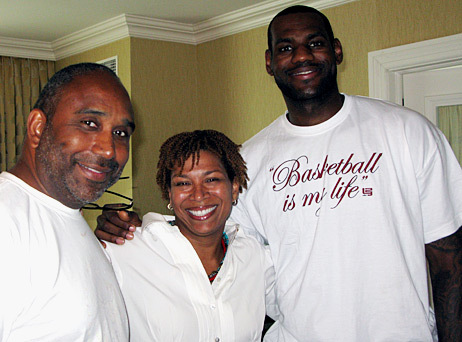 Host Michel Martin (center) poses with NBA star LeBron James of the Cleveland Cavaliers (right) and Dru Joyce II, James' former high school basketball coach.