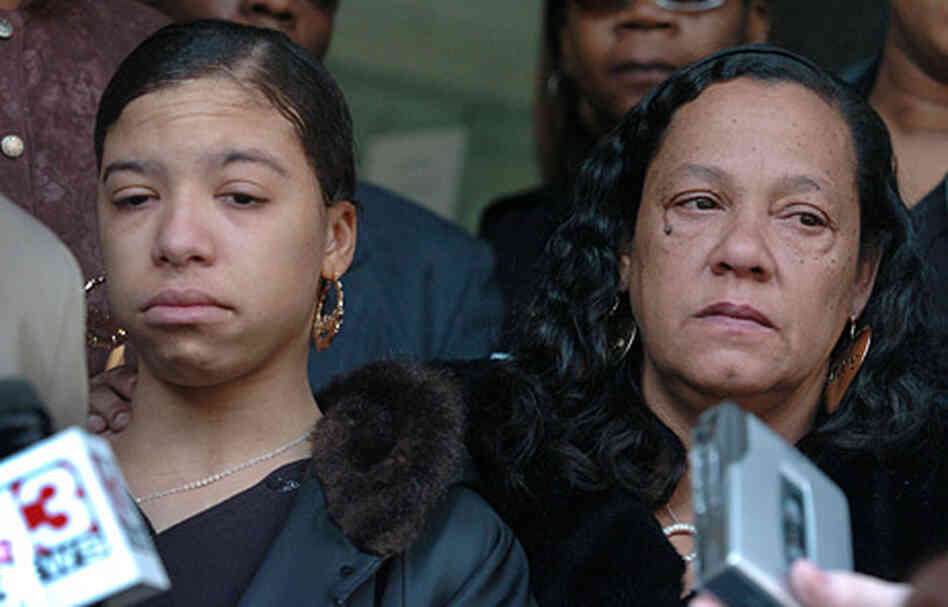 Megan Williams, left, and her mother Carmen Williams (now deceased) stand outside of the Logan Count Megan Williams, left, and her mother Carmen Williams (now deceased) stand outside of the Logan Count