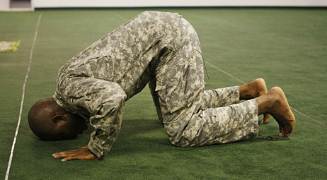 Army Maj. Dawud Agbere, who is a Muslim, prays at a mosque outside Fort Hood in Killeen, Texas on Monday.