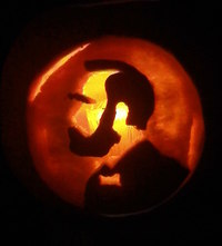 Pumpkin carved to look like Nobel symbol.
