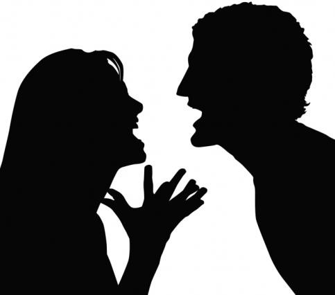 Silhouette of a couple arguing.