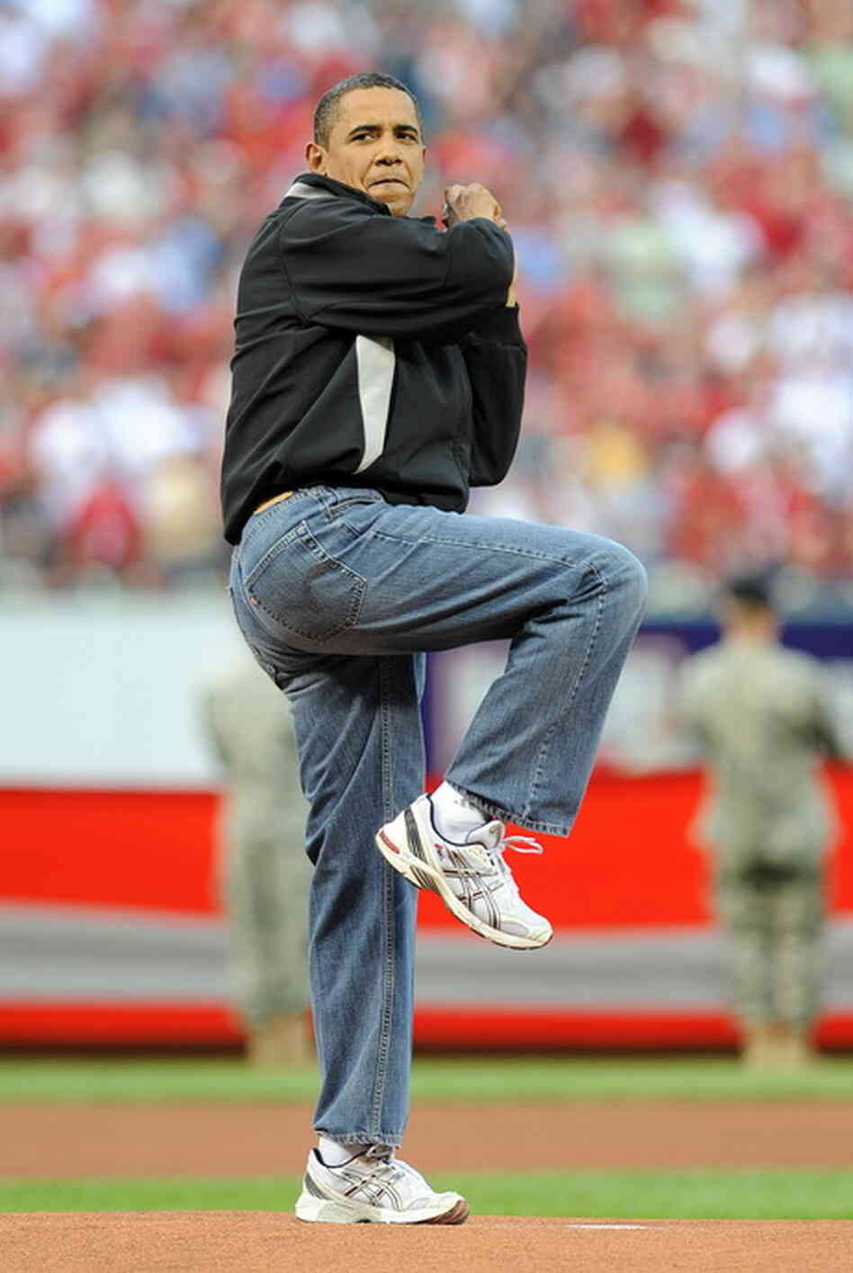 Photo of President Obama throwing a pitch. Photo of President Obama throwing a pitch.