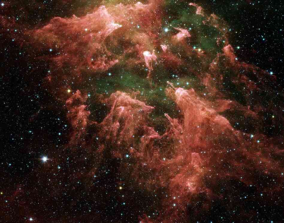 This Spitzer image shows the South Pillar area of the star-forming region called the Carina Nebula.  Like cracking open a watermelon and finding its seeds, the infrared telescope "busted open" this murky cloud to reveal star embryos (yellow or white) tucked inside fingerlike pillars of thick dust (pink).