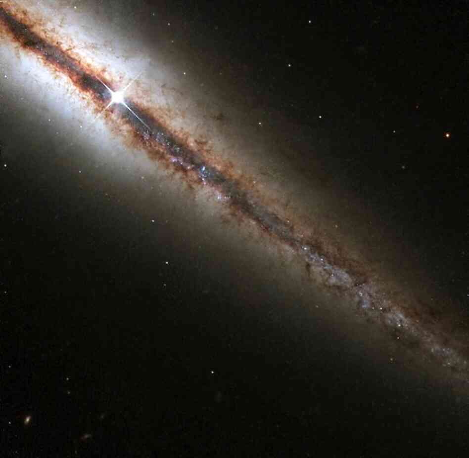 "A galaxy on the edge," taken by the Hubble telescope, is located in Ursa Major.  Instead of being viewed face-on, this galaxy is seen edge-on from our perspective.