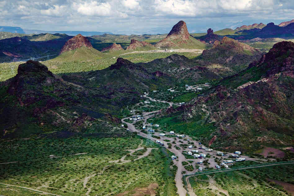 Recreational trailers appear to spill out of the hills near Lake Havasu, north of Lake Havasu City, Ariz.