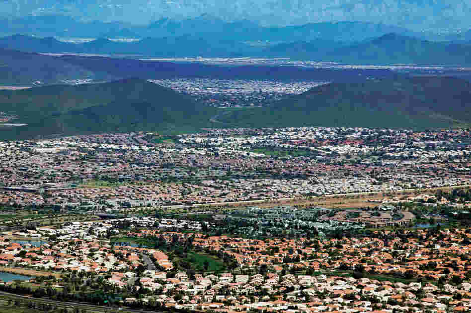 Tract housing blankets the Phoenix suburbs and fills in the area's expansive valleys.  Zoned single-use suburban landscapes virtually necessitate a car, and enclave neighborhoods and cul-de-sacs make it difficult to navigate through the area.