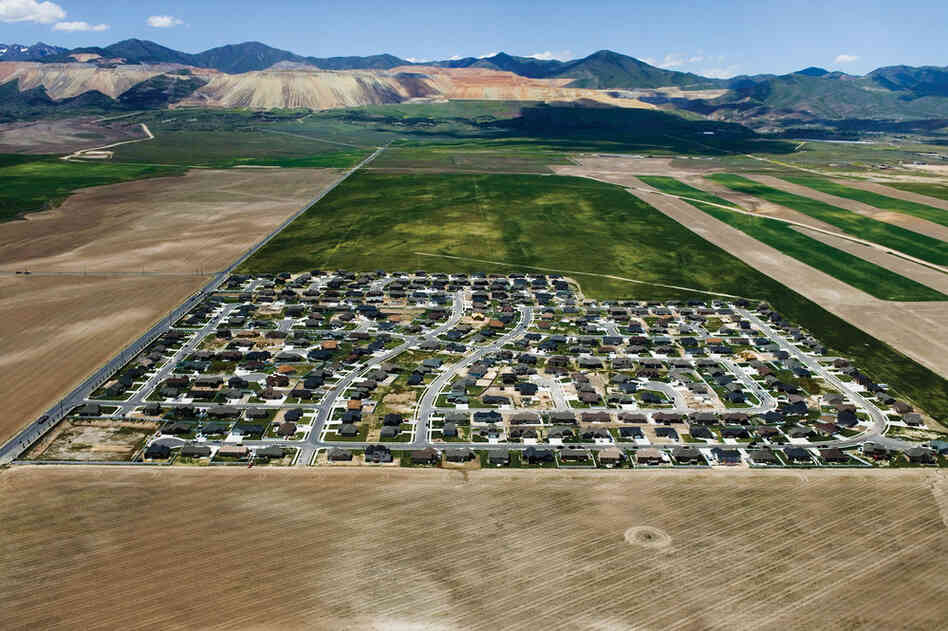 Isolated exurban communities in Utah built on cheap agricultural land depend on cars for nearly every activity. To access urban centers, residents often have to commute long distances. Because the land is virtually undeveloped, all aspects of modern infrastructure (water, sewer, electric and roads) must be extended.