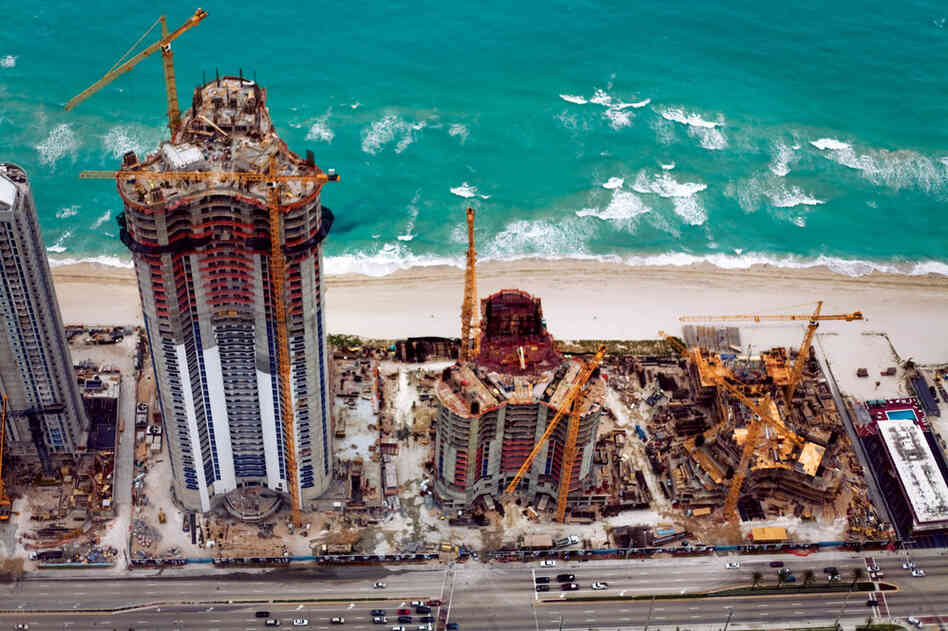 Despite the destructive hurricanes and rising sea levels that have hit the Sunny Isles community in Florida, developers continue to build close to the shoreline. Trump Towers Miami is one of many high-rise structures going up on the coast between Fort Lauderdale and Miami.