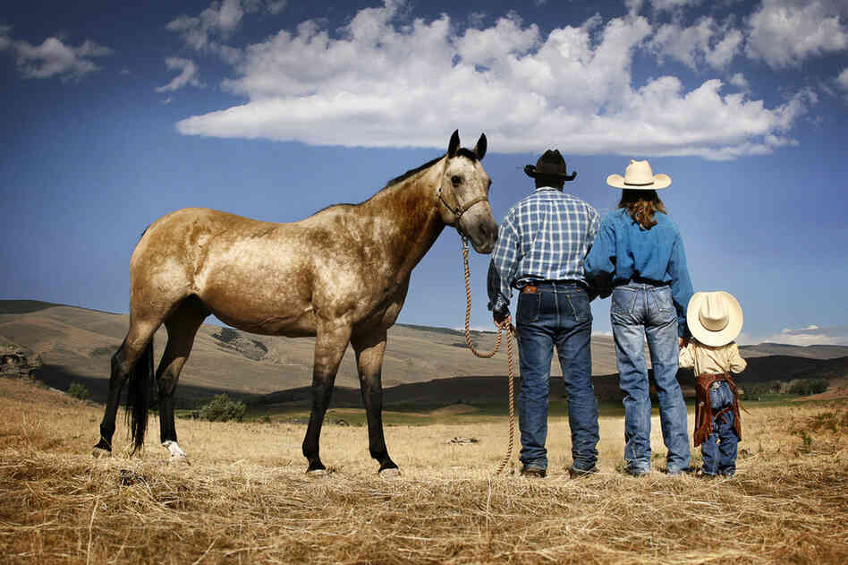 Thad and Andrea Dockery, cattle ranchers in Jeffrey City, Wyo., stand with their daughter, Laura.  "We love our land and the way of life," says Andrea.