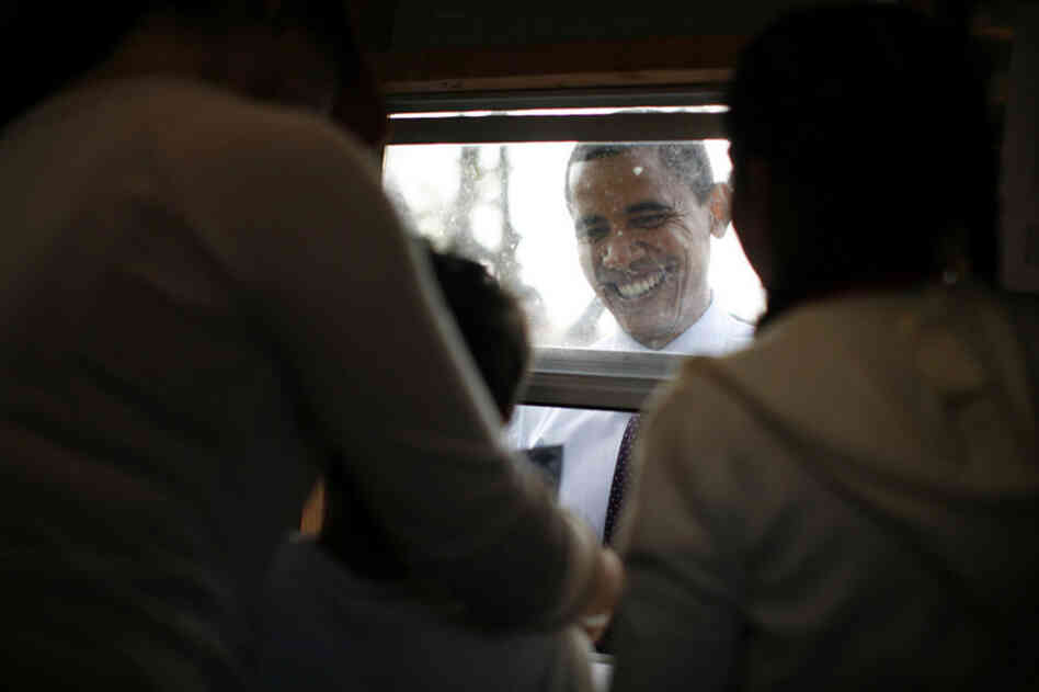 Obama buys tickets for food and rides at the Sombrero Festival in Brownsville, Texas.